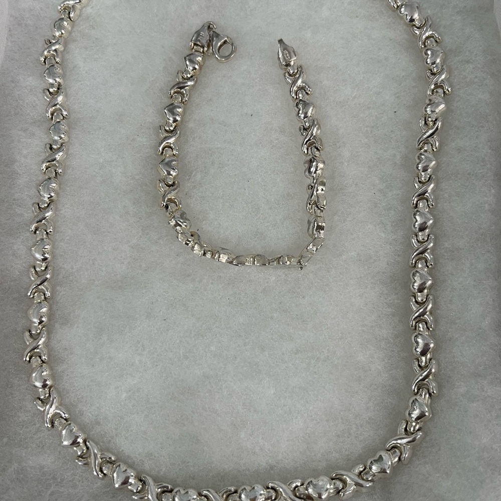 Intricate Silver Necklace with Twisted Design and Sparkling Stones